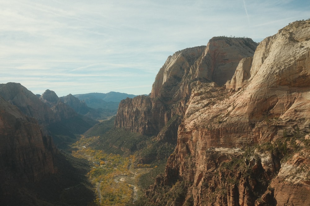 a view of a valley with mountains in the background