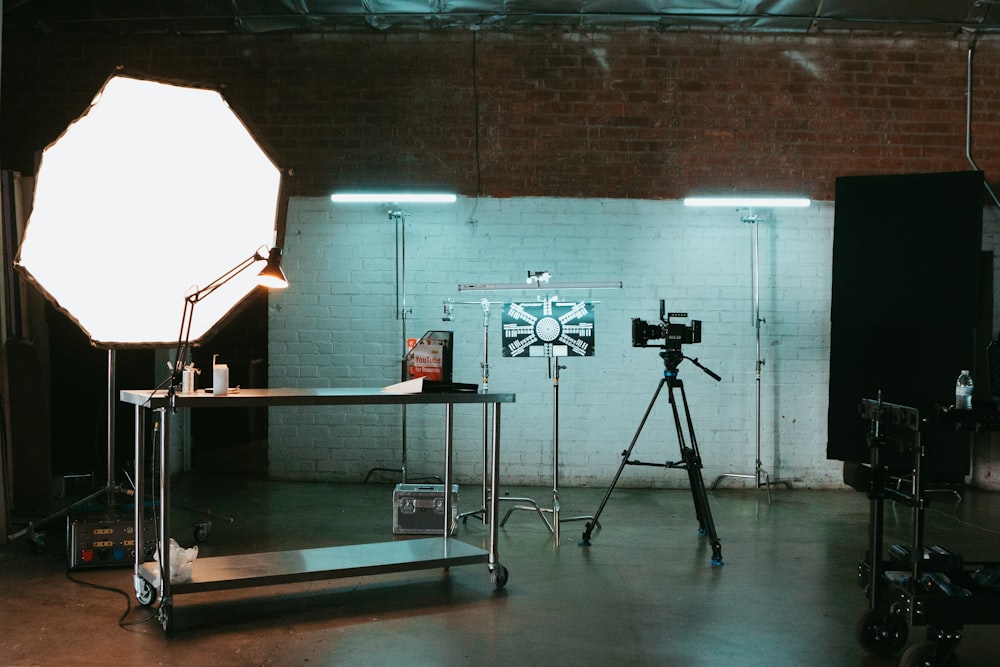 a photo studio with a camera and a tripod