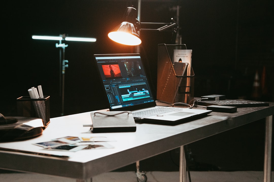 a laptop computer sitting on top of a desk,