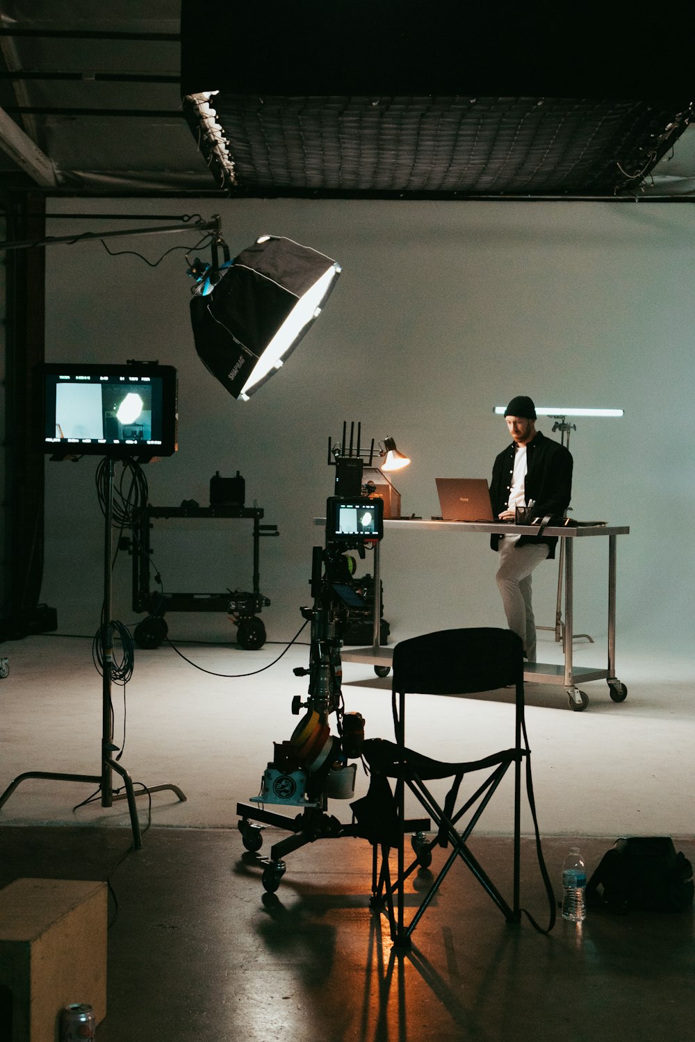 a man sitting at a desk in front of a laptop computer