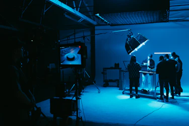 a group of people standing in a dark room
