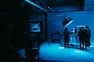 a group of people standing in a dark room