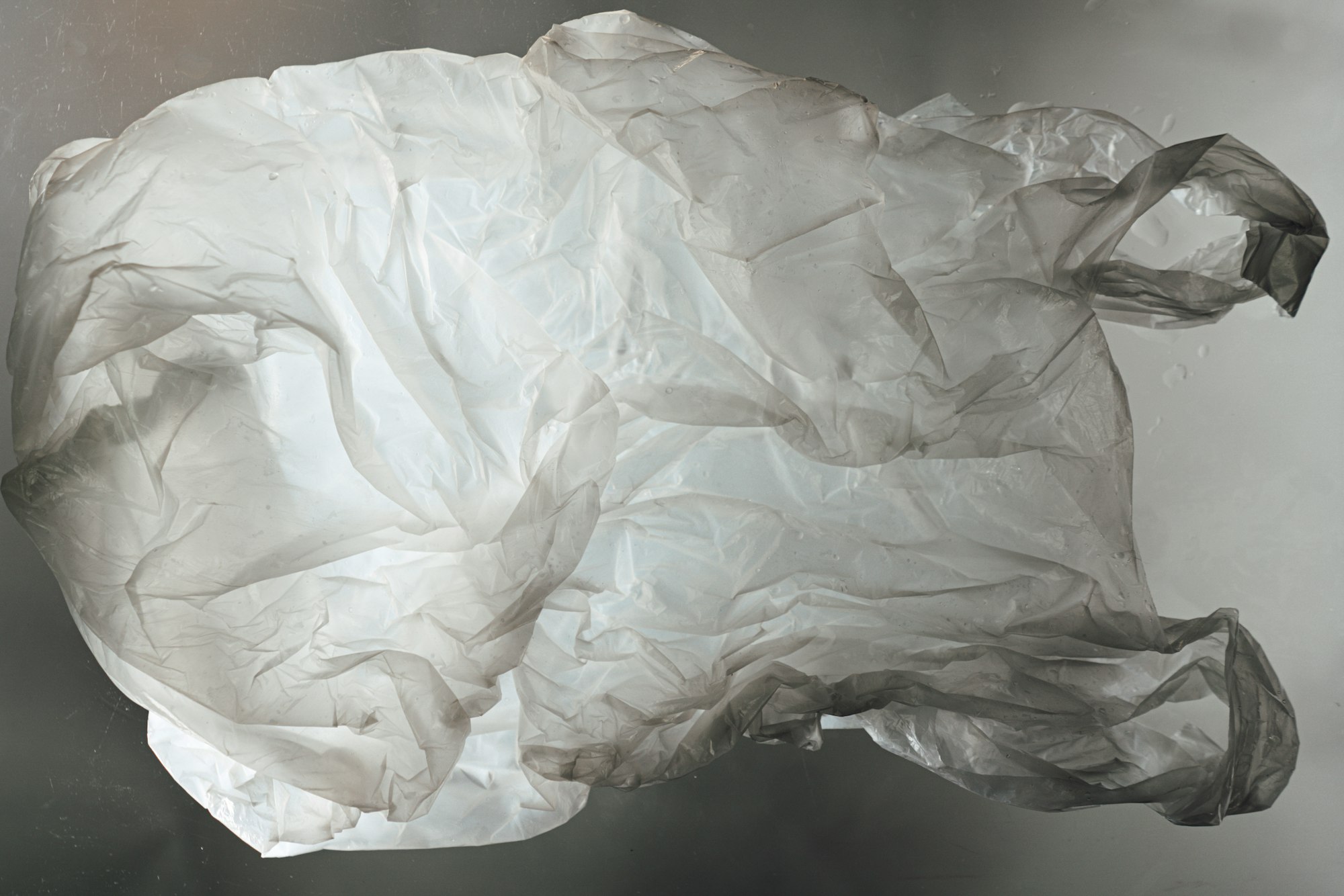 a crumpled piece of plastic floating in the air
