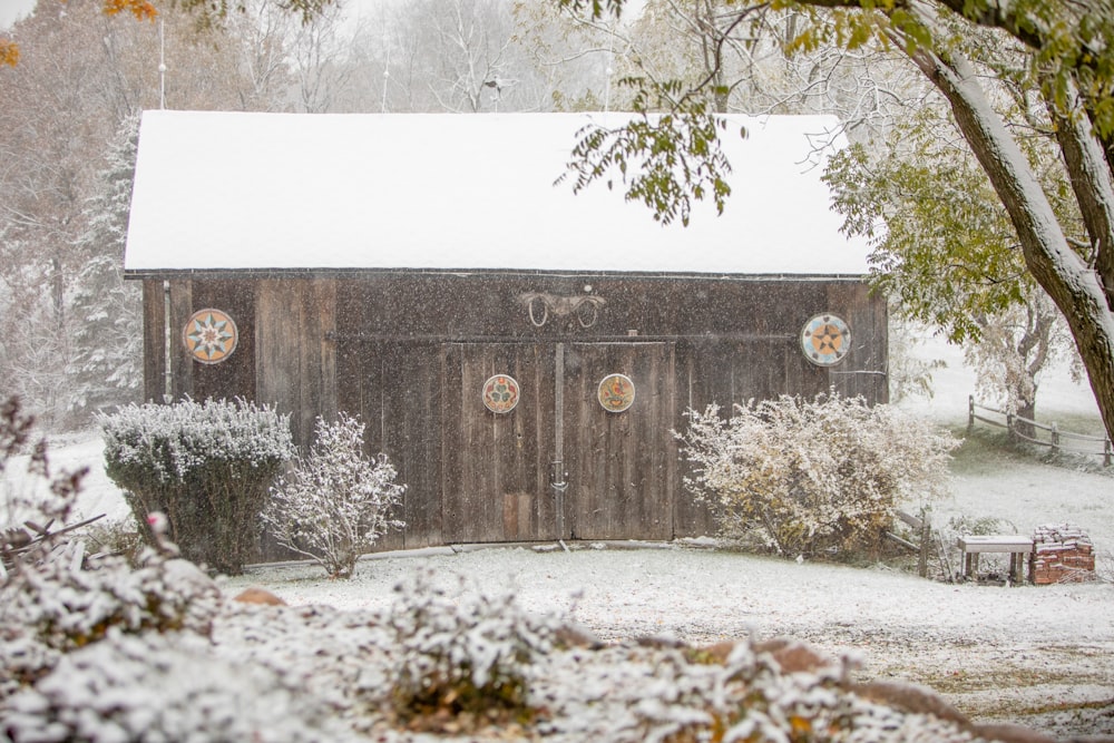 a barn with a clock on the side of it