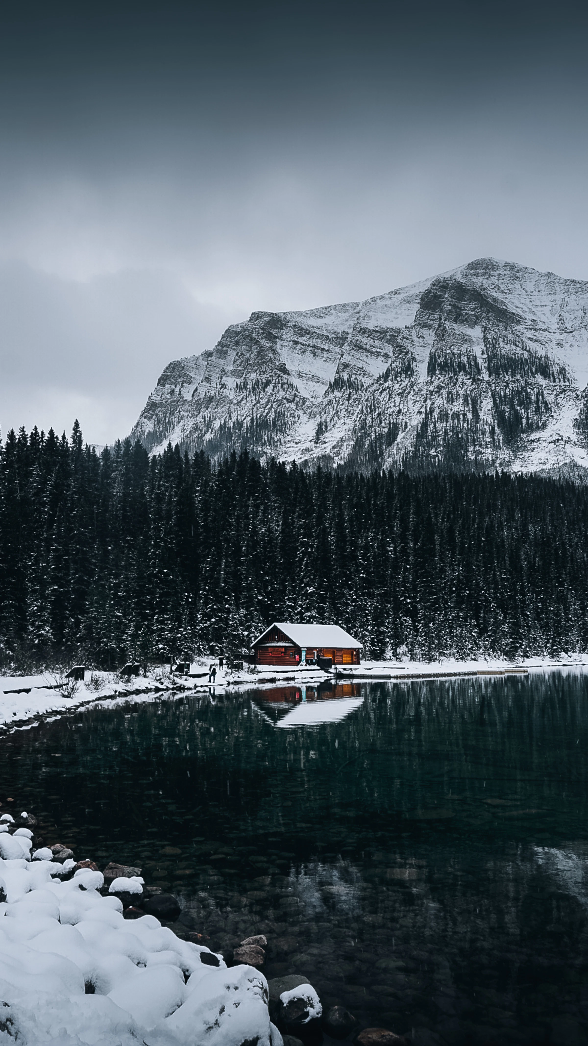 Cabin on a mountain lake in winter
