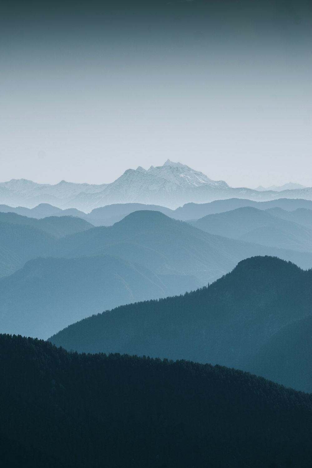 a black and white photo of a mountain range