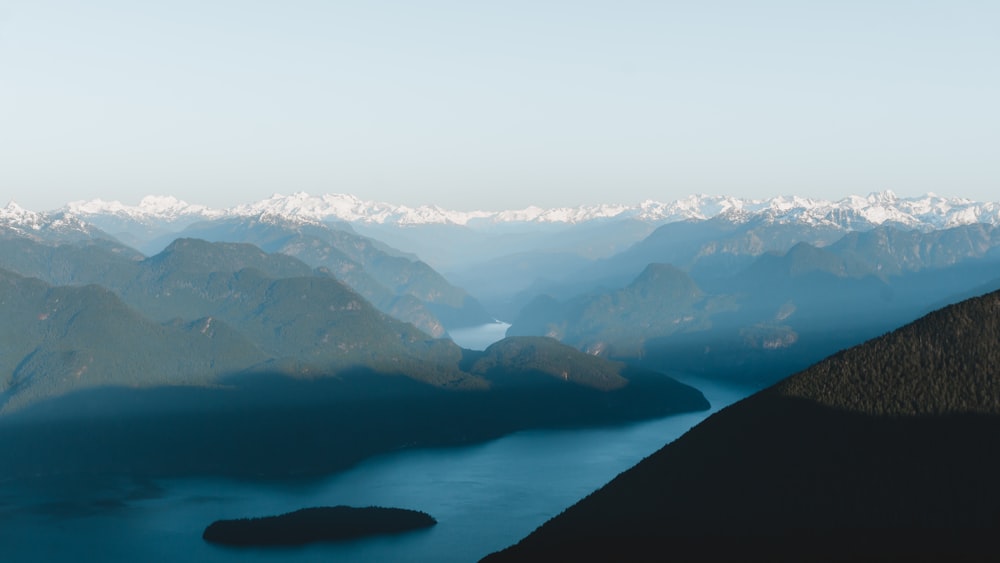 a view of water and a mountain in the background