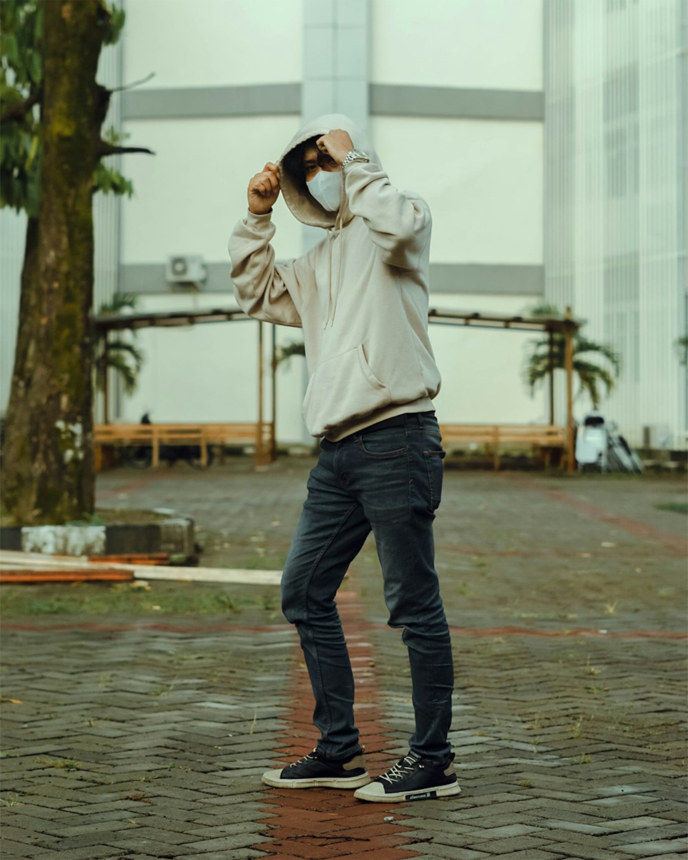 a man walking in the rain