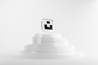 a white object with a black square on top of it