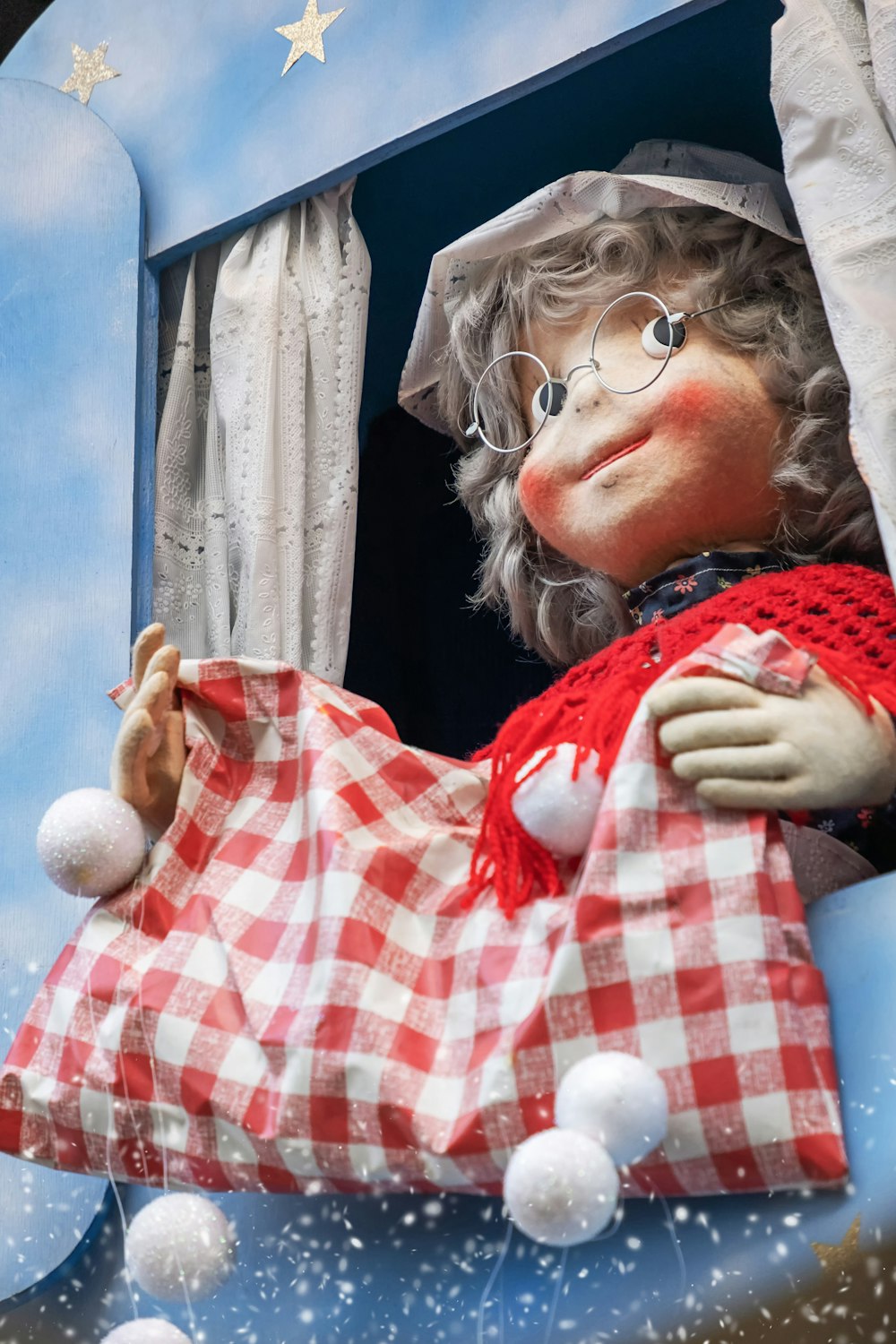 a close up of a stuffed animal in a window