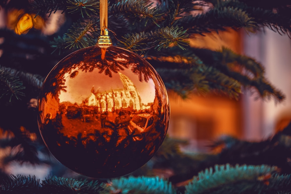 a christmas ornament hanging from a christmas tree