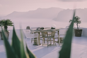 An elegant dining setup overlooking a scenic view.