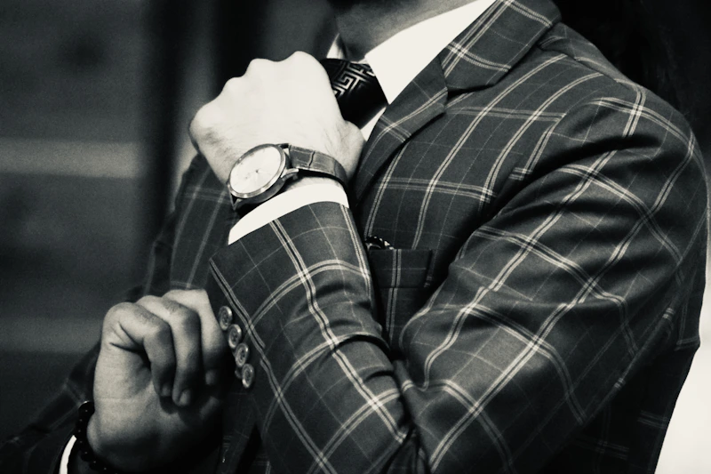 elegant man in a suit wearing a statement watch