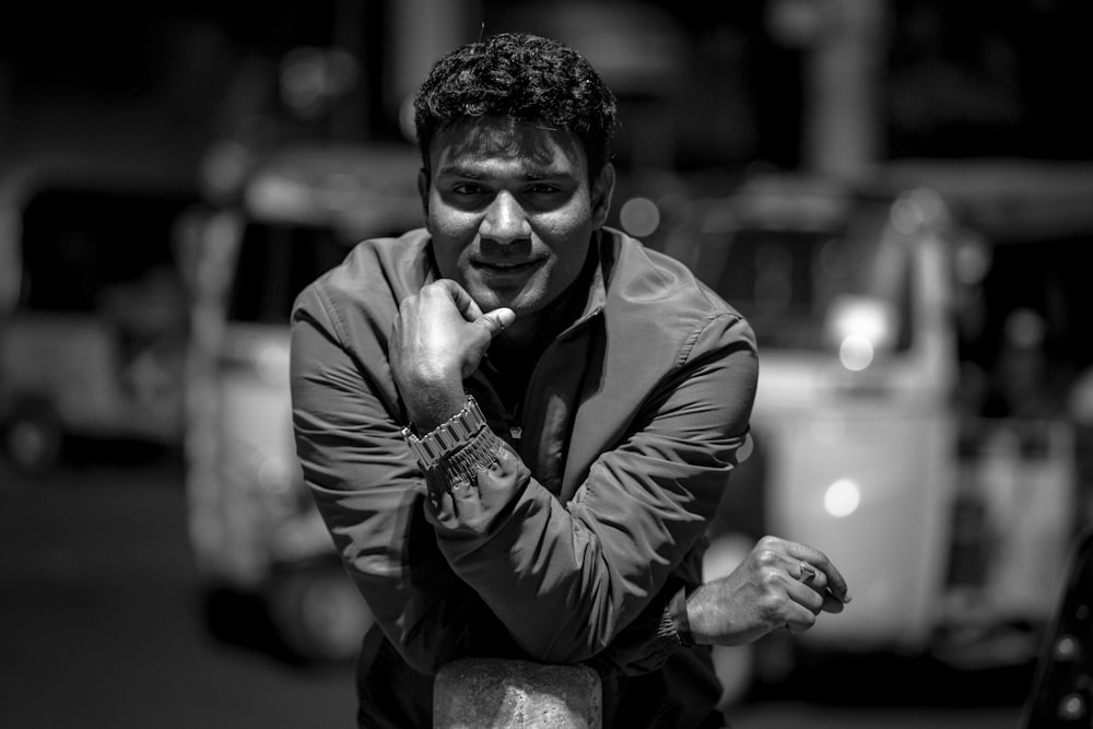 a black and white photo of a man posing for a picture