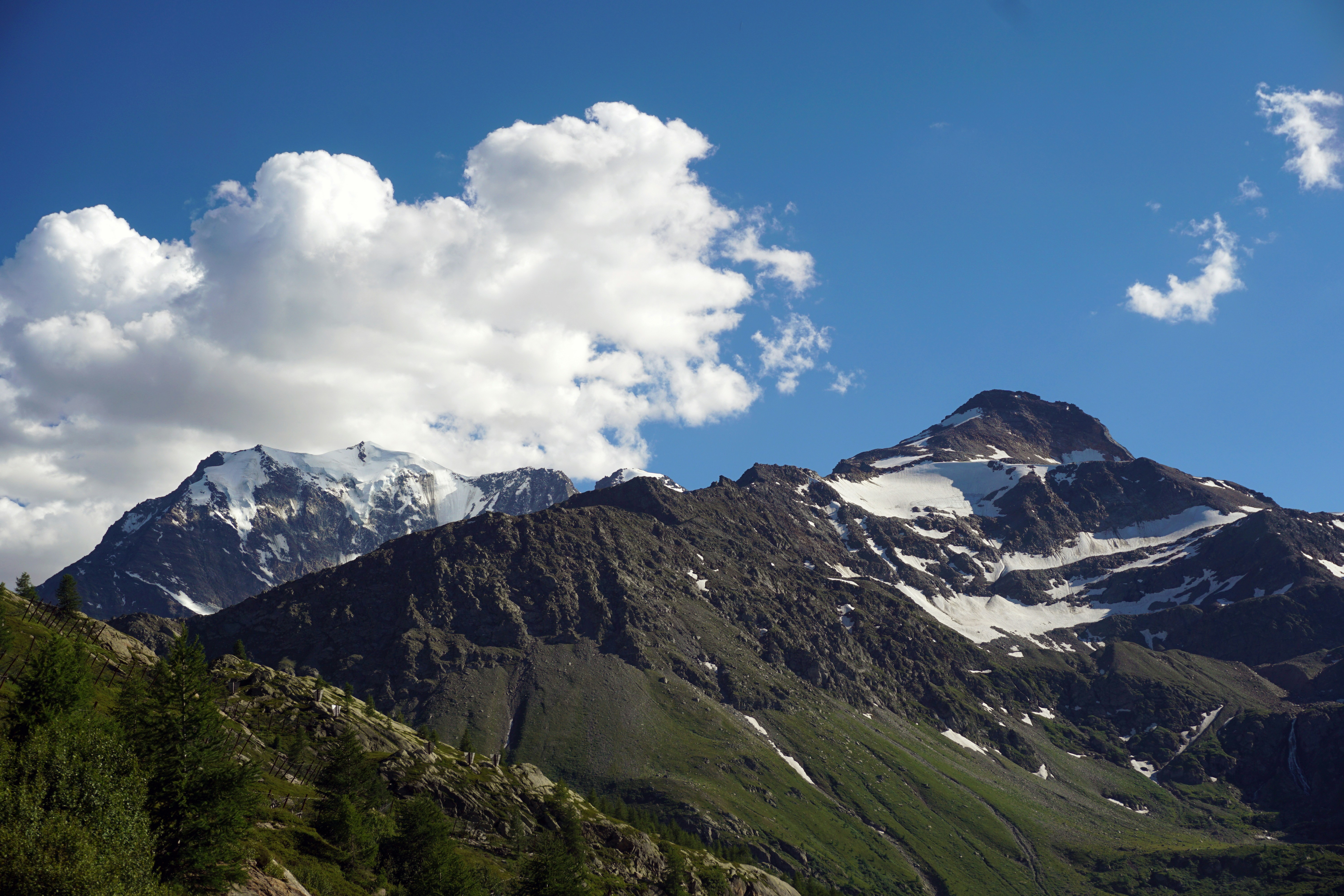 a view of a mountain range with snow on the top