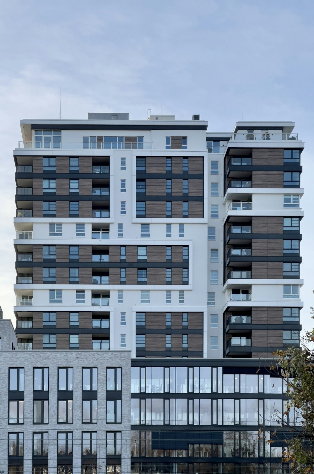 a tall white building with lots of windows