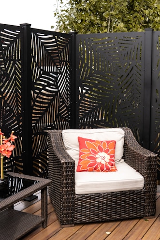 A vibrant outdoor back chair cushion tied securely to a patio chair.