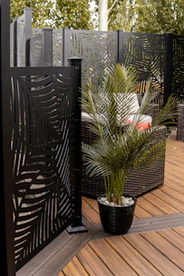 a potted plant sitting on top of a wooden deck