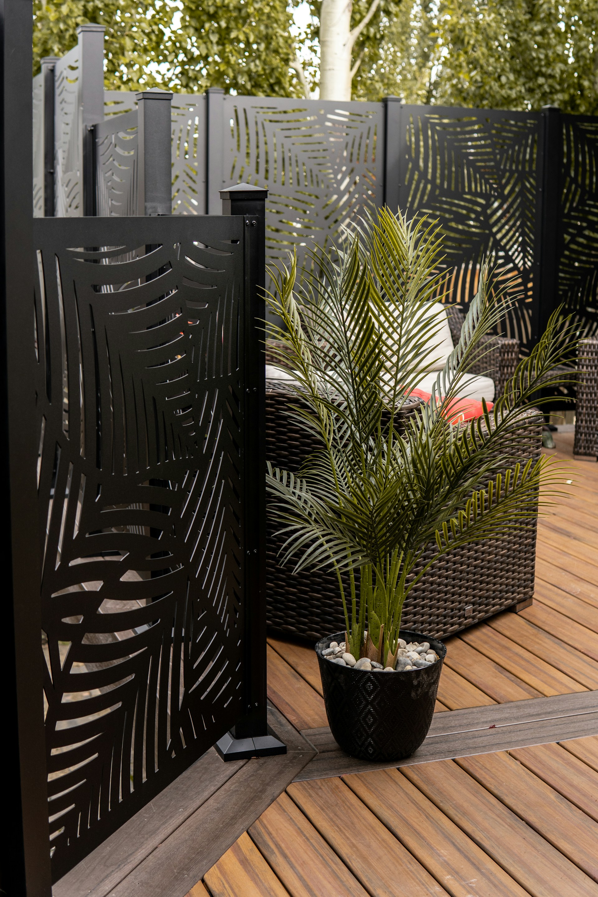 a potted plant sitting on top of a wooden deck
