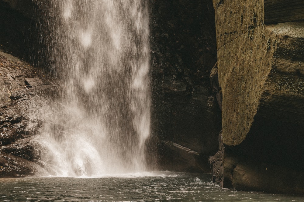 a waterfall with water coming out of it