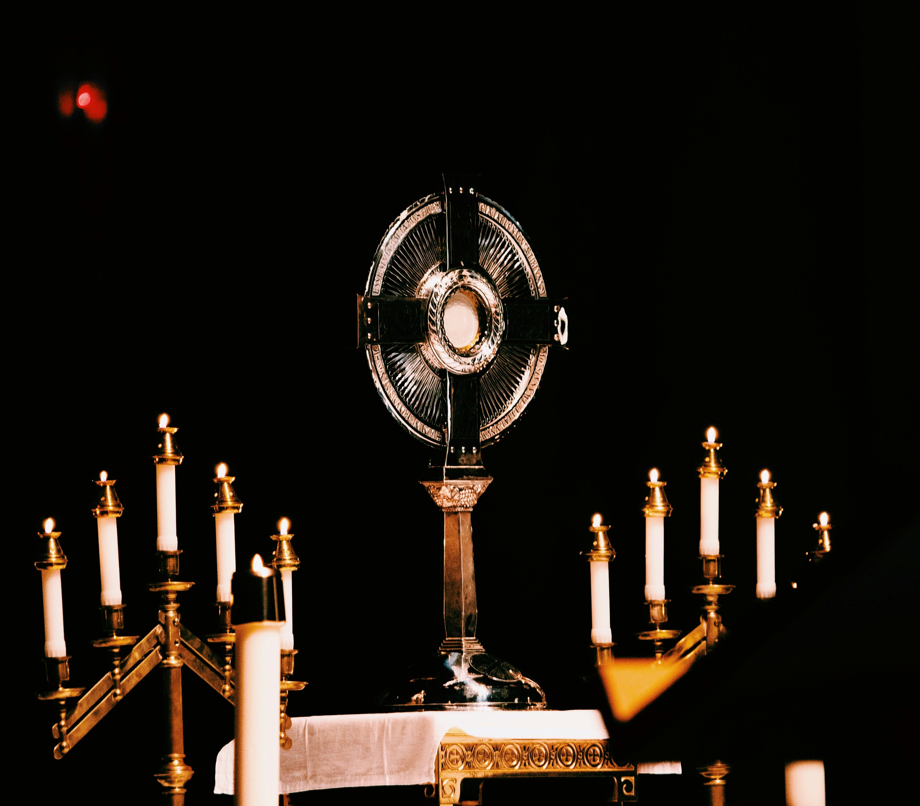 a table with candles and a fan on it