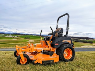 a lawn mower parked on the side of a road