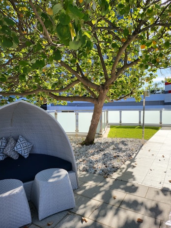 A beautifully landscaped backyard with modern paving and cozy outdoor seating.