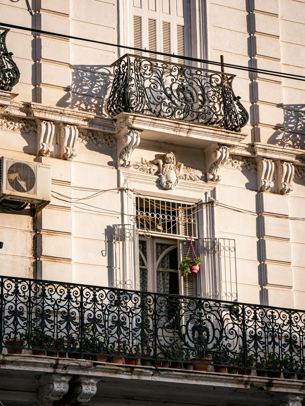 the balcony of a building with wrought iron balconies