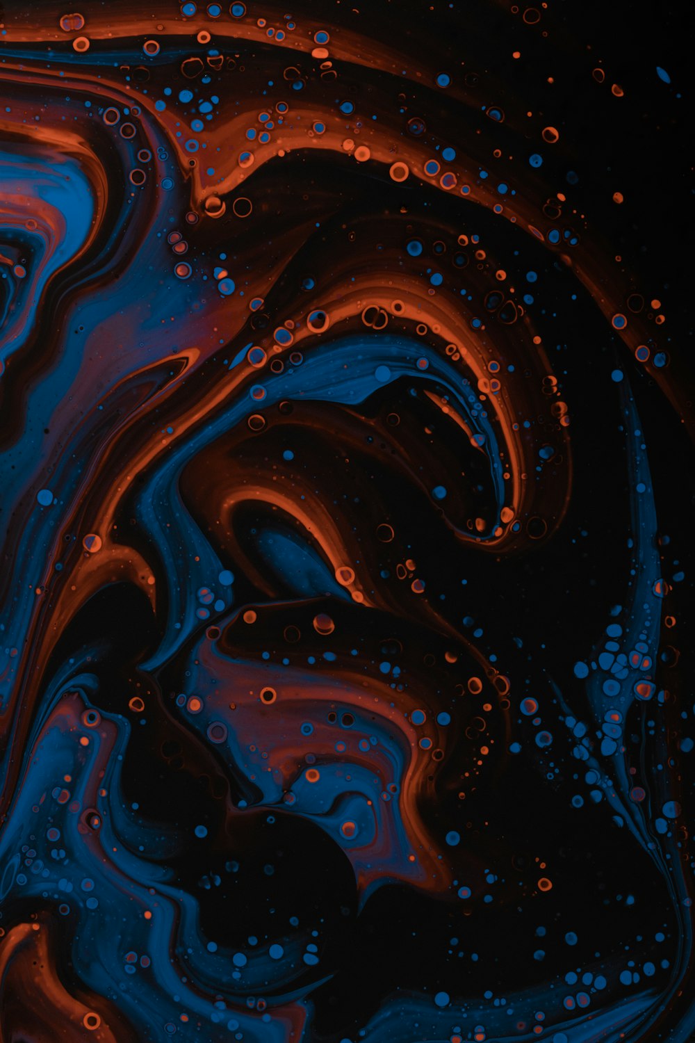a close up of a blue and red liquid
