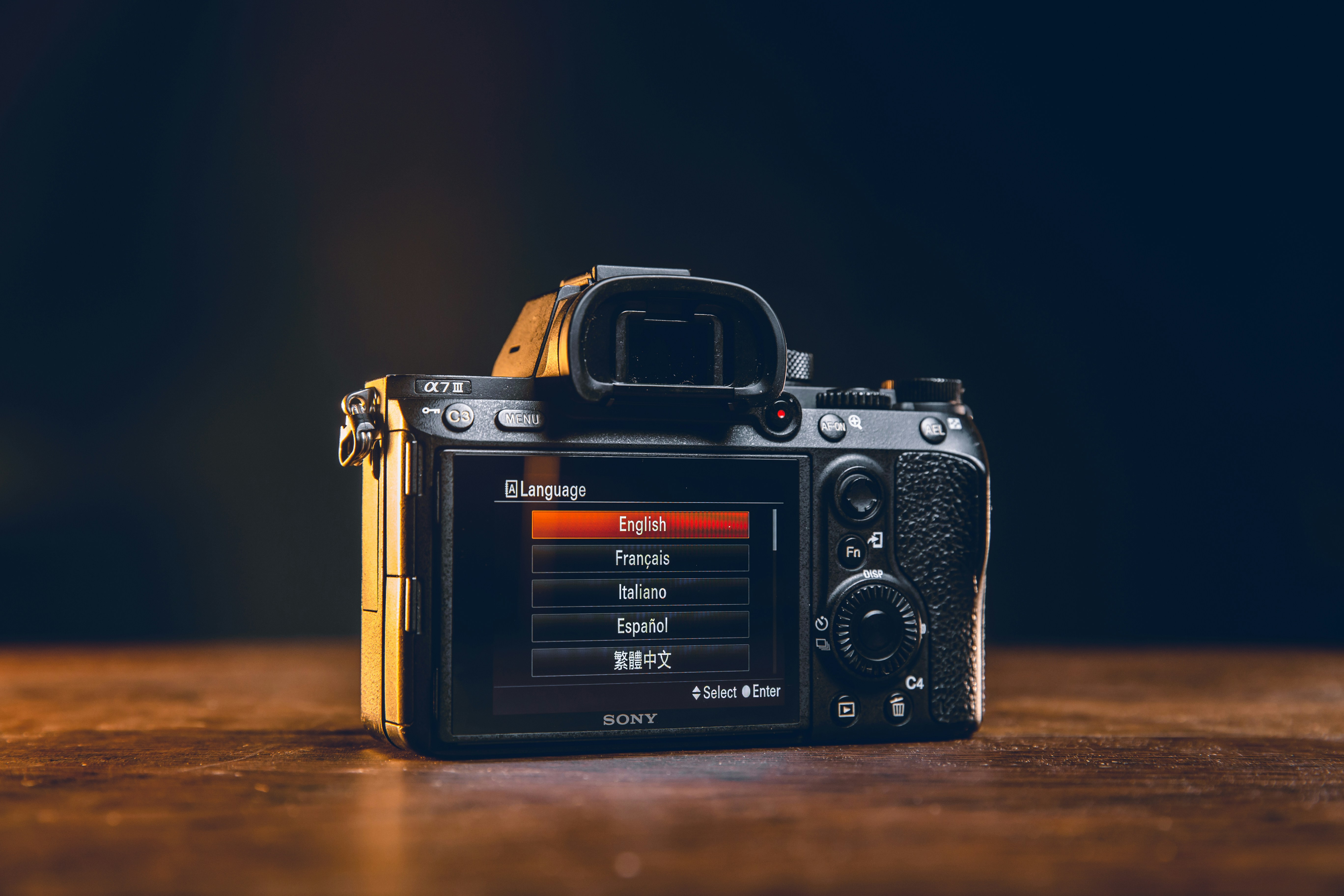a camera sitting on top of a wooden table