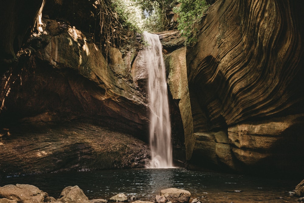 a small waterfall cascading into a pool of water