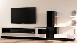 a flat screen tv mounted to the side of a wall