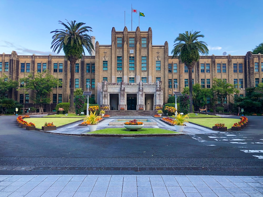 a large building with a fountain in front of it