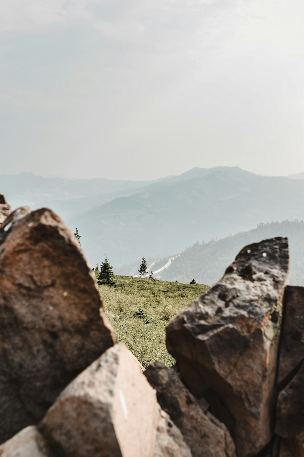 a person standing on top of a rocky hill