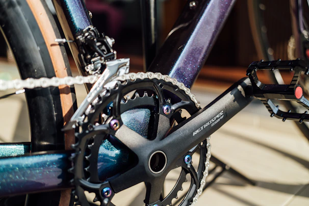 Close-up of the KTM Macina Team 791 electric bike's high-end components shining under the sun.