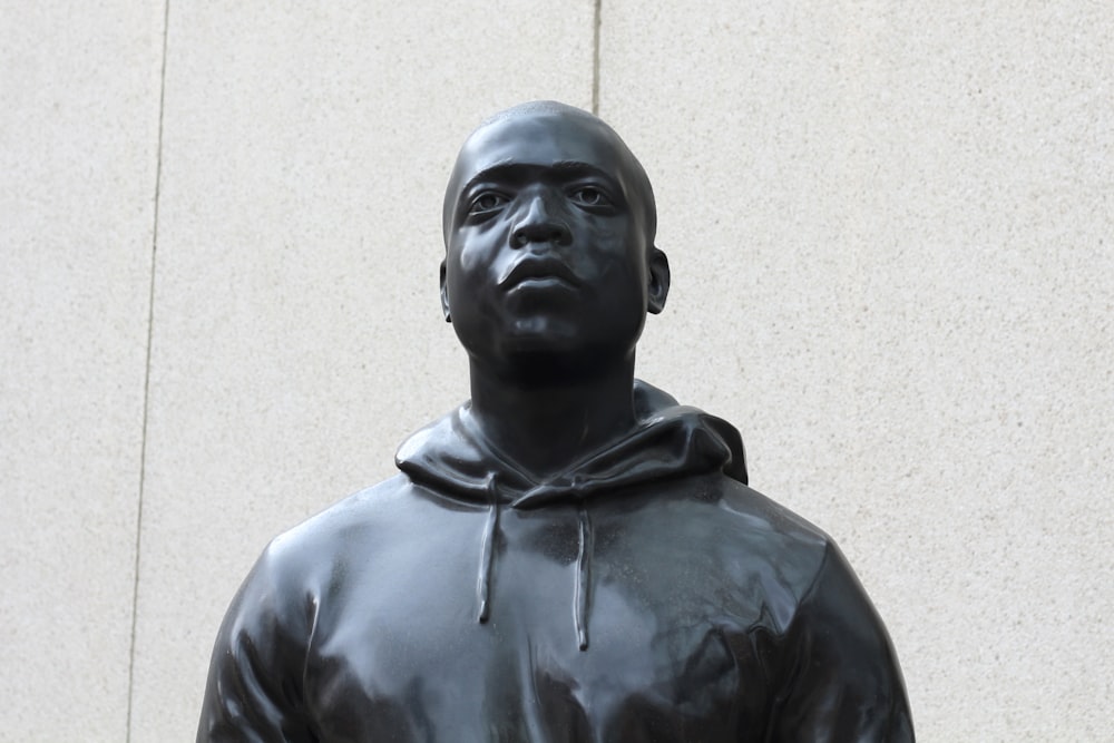 a statue of a man with a hoodie on