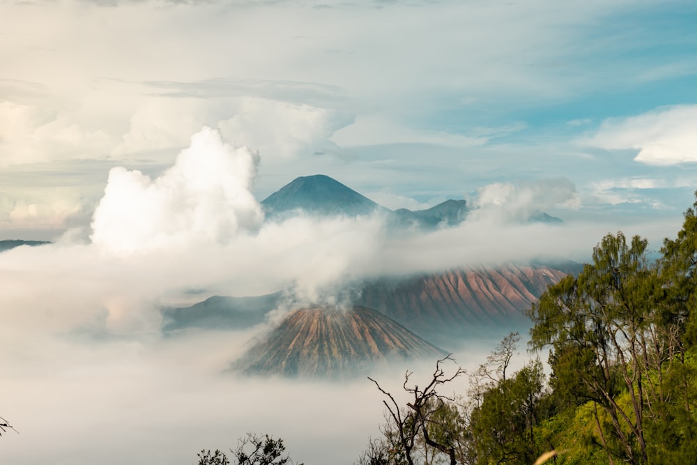 a view of a mountain covered in clouds