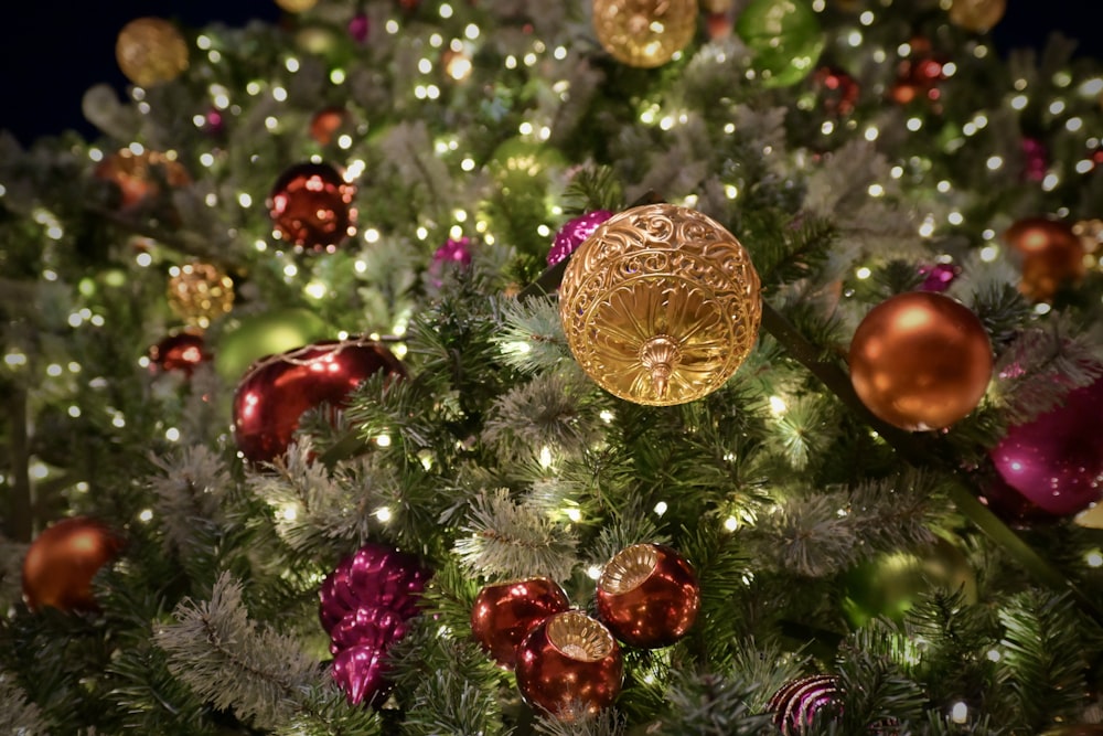 a close up of a christmas tree with ornaments