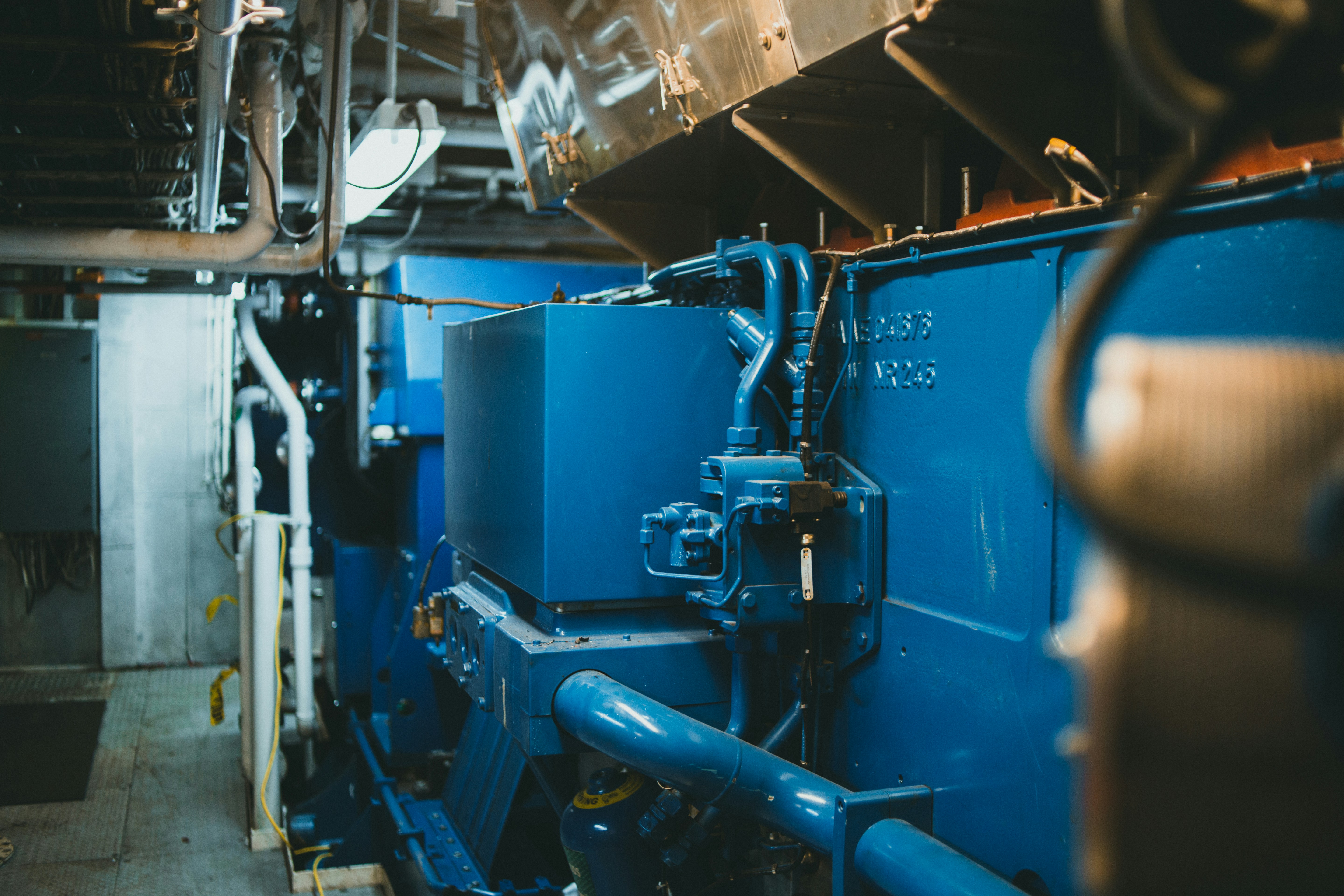 a large blue machine in a large room