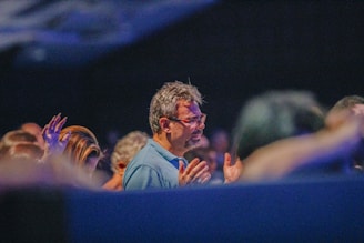 a man standing in front of a crowd of people