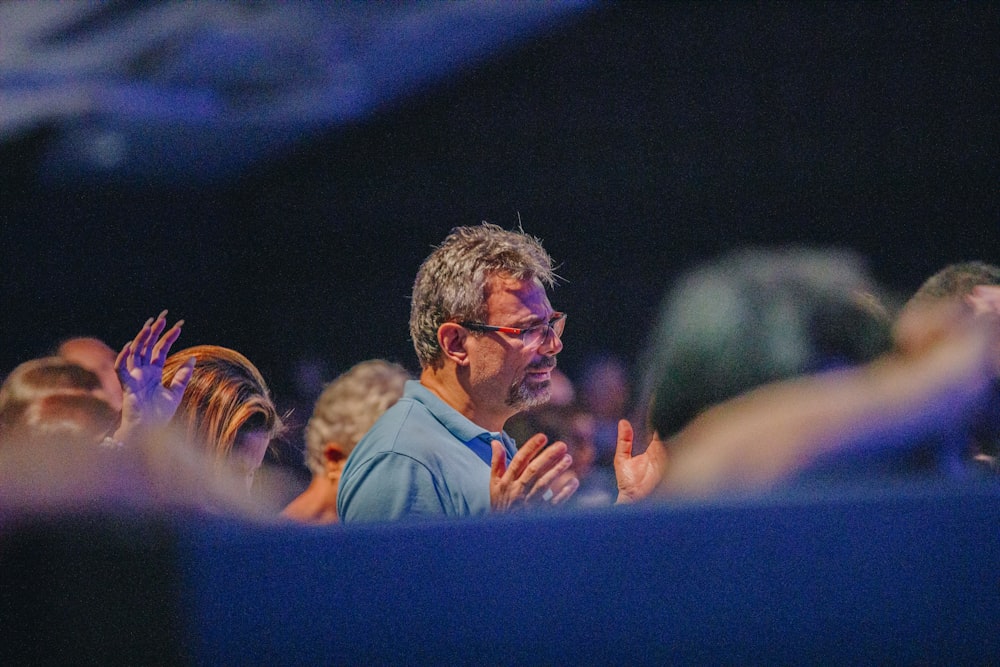 a man standing in front of a crowd of people