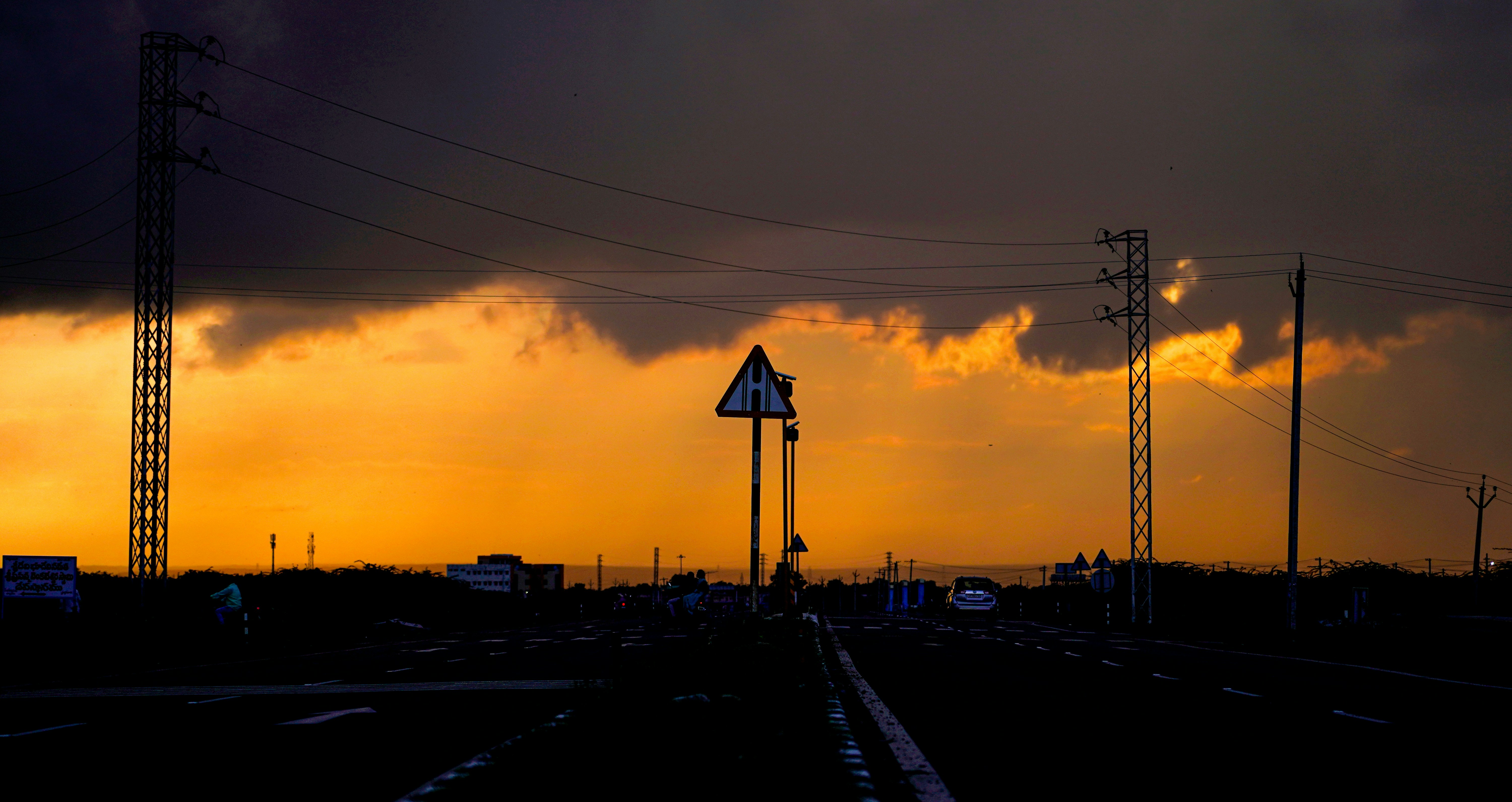 a train track with a sky in the background