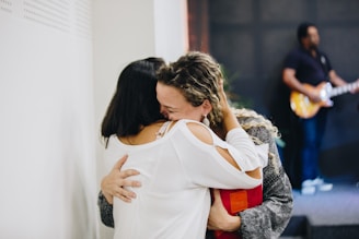 a couple of people that are hugging each other