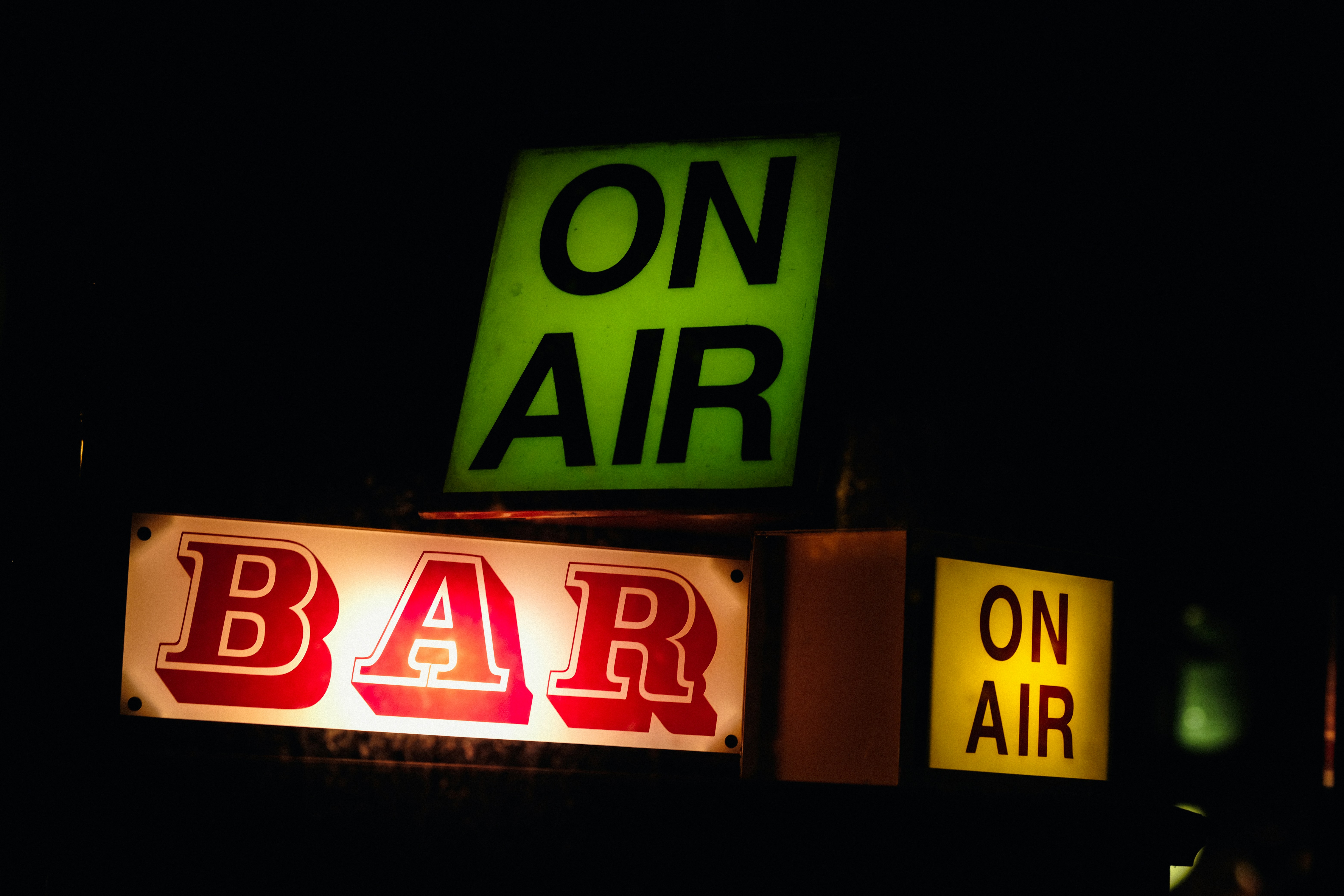 a neon sign that says on air and bar on air