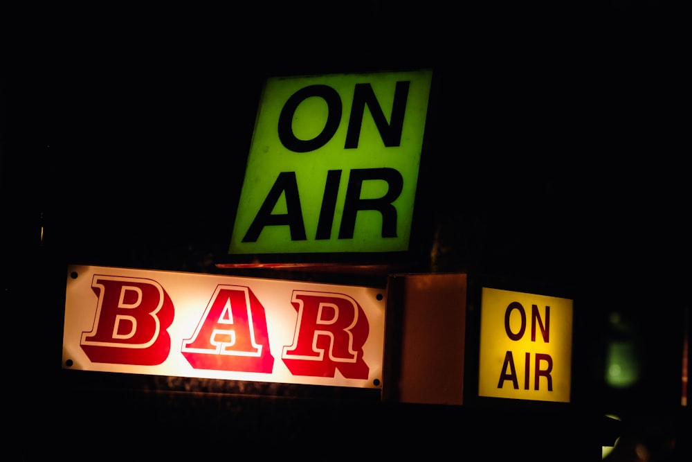 a neon sign that says on air and bar on air