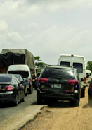 Fleet vehicles on the road with GPS tracking overlays.