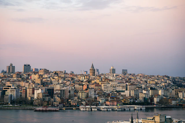 Galata Tower rising above Istanbul’s historic waterfront at sunset