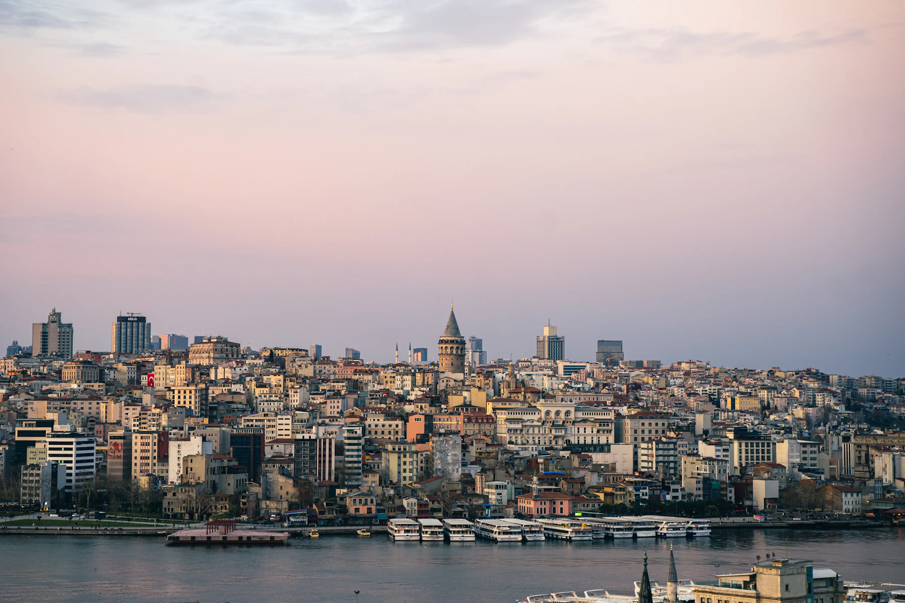 Galata Tower rising above Istanbul’s historic waterfront at sunset