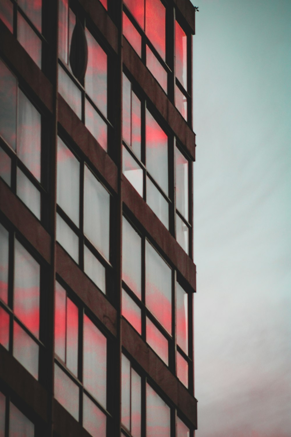 a tall building with lots of windows and a clock