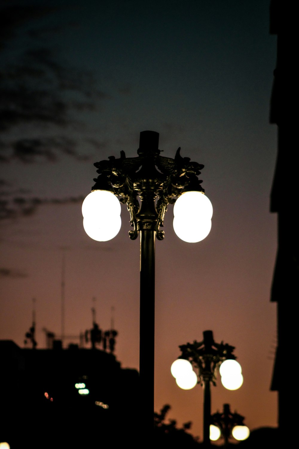 a couple of street lights sitting next to each other